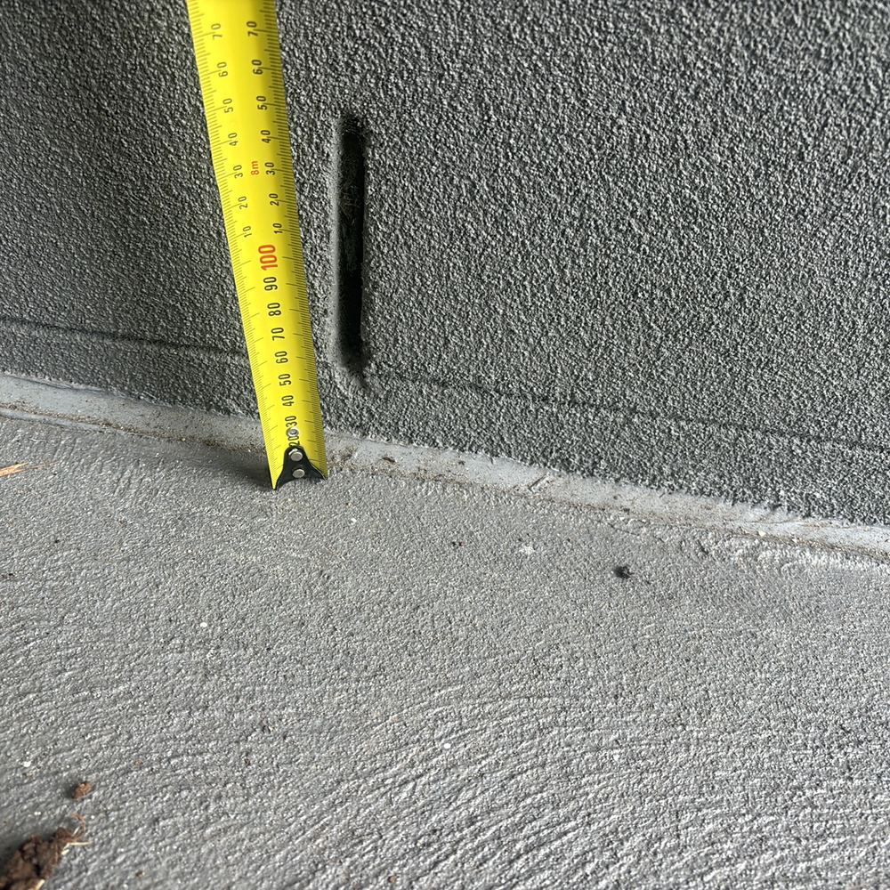 Weep holes sitting less than 150mm above the ground beside them, found during a pre-handover inspection in Werribee