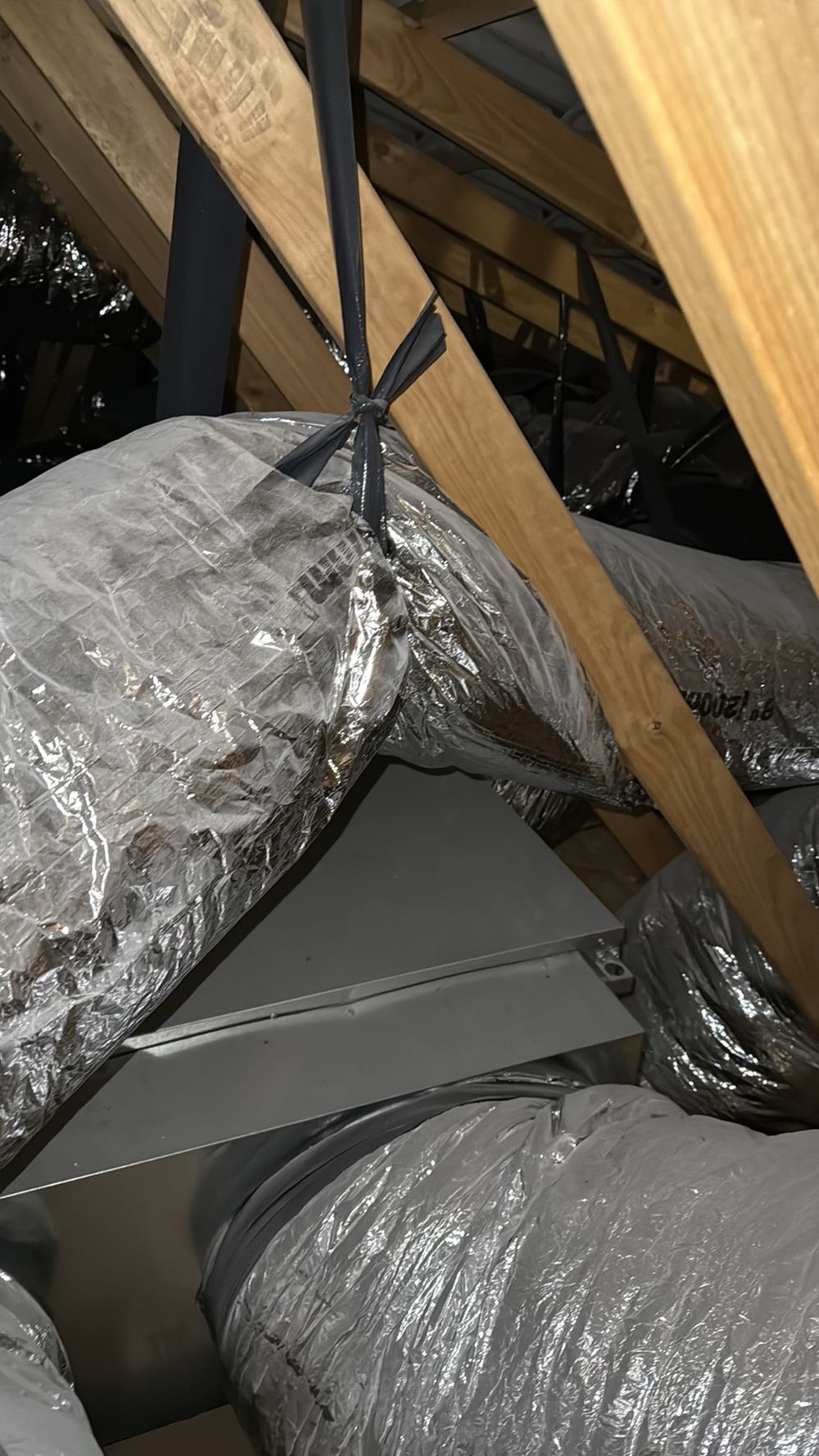 Ducts bent tighter than their own diameter, reducing air to the rooms, found during a pre-handover inspection in Werribee