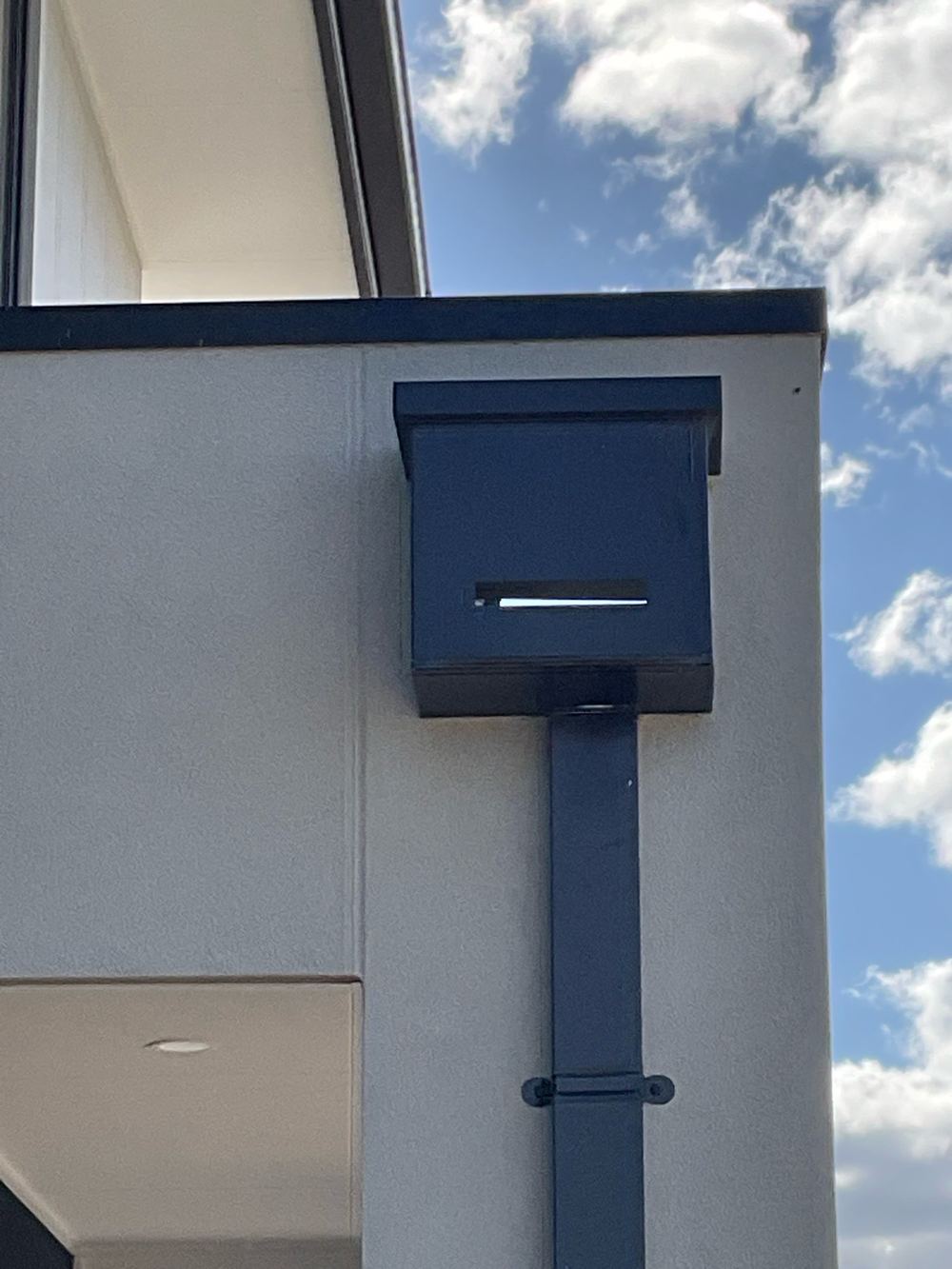 Rainhead built with a slot overflow instead of the required open weir, found during a pre-handover inspection in Werribee