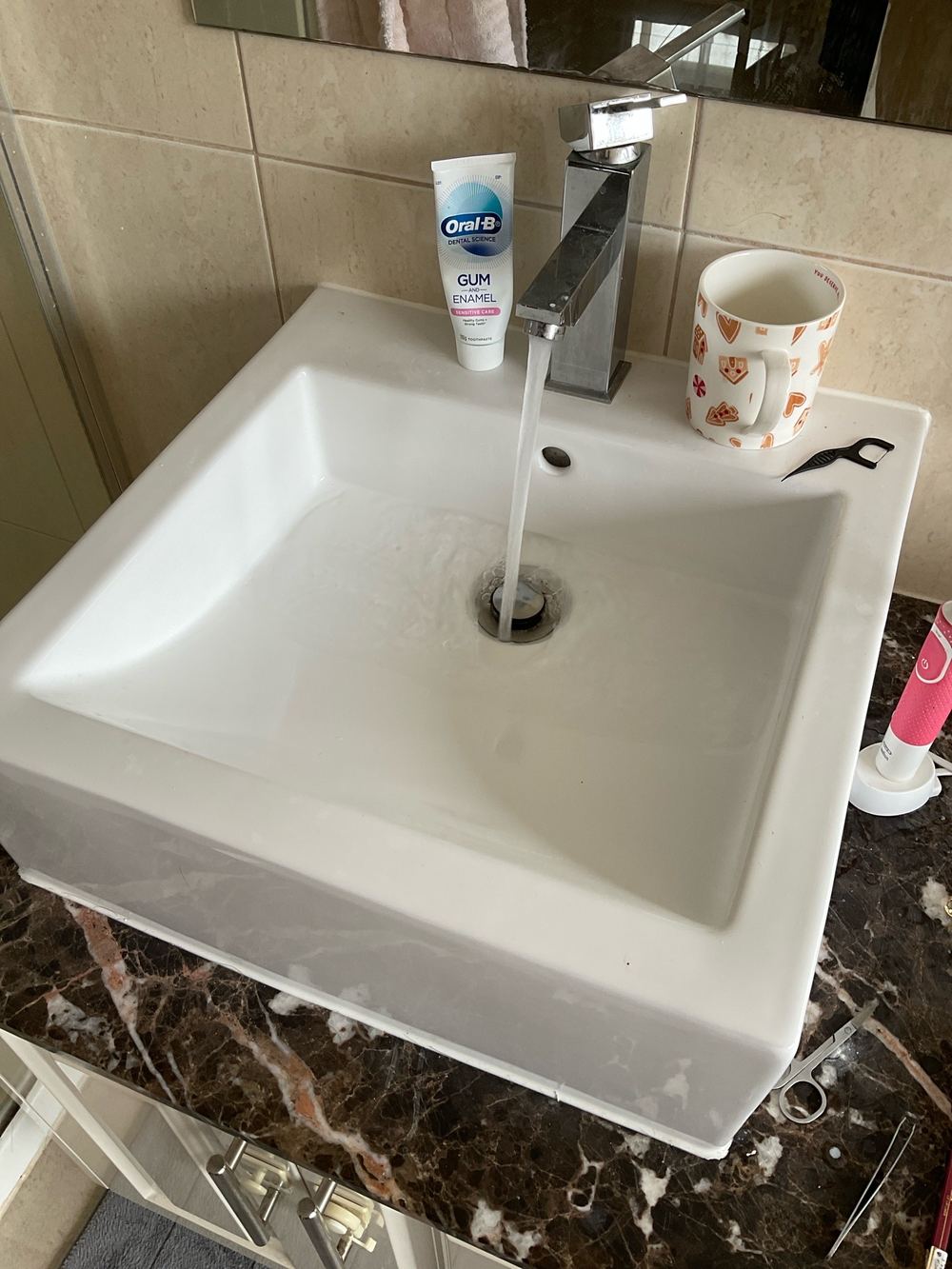 Basin waste draining slowly through a restricted trap, found during a pre-purchase inspection in Sunshine North