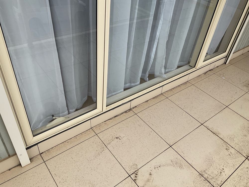 Drummy tiles with open gaps where wind driven rain can get in, Sunshine North, Werribee