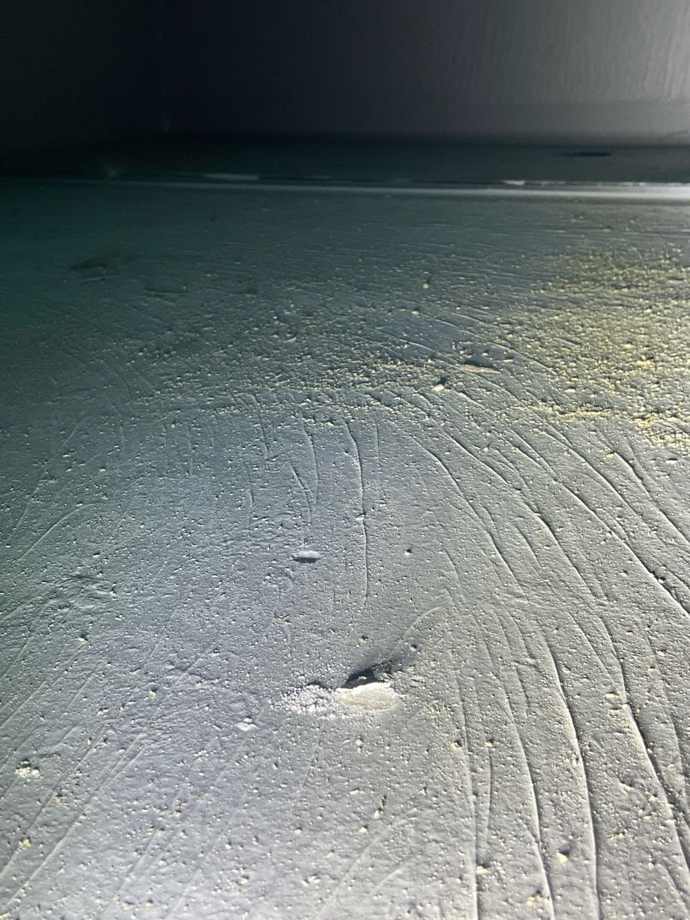 Membrane damaged on the shower floor while other trades worked around it, found during a waterproofing inspection in Werribee